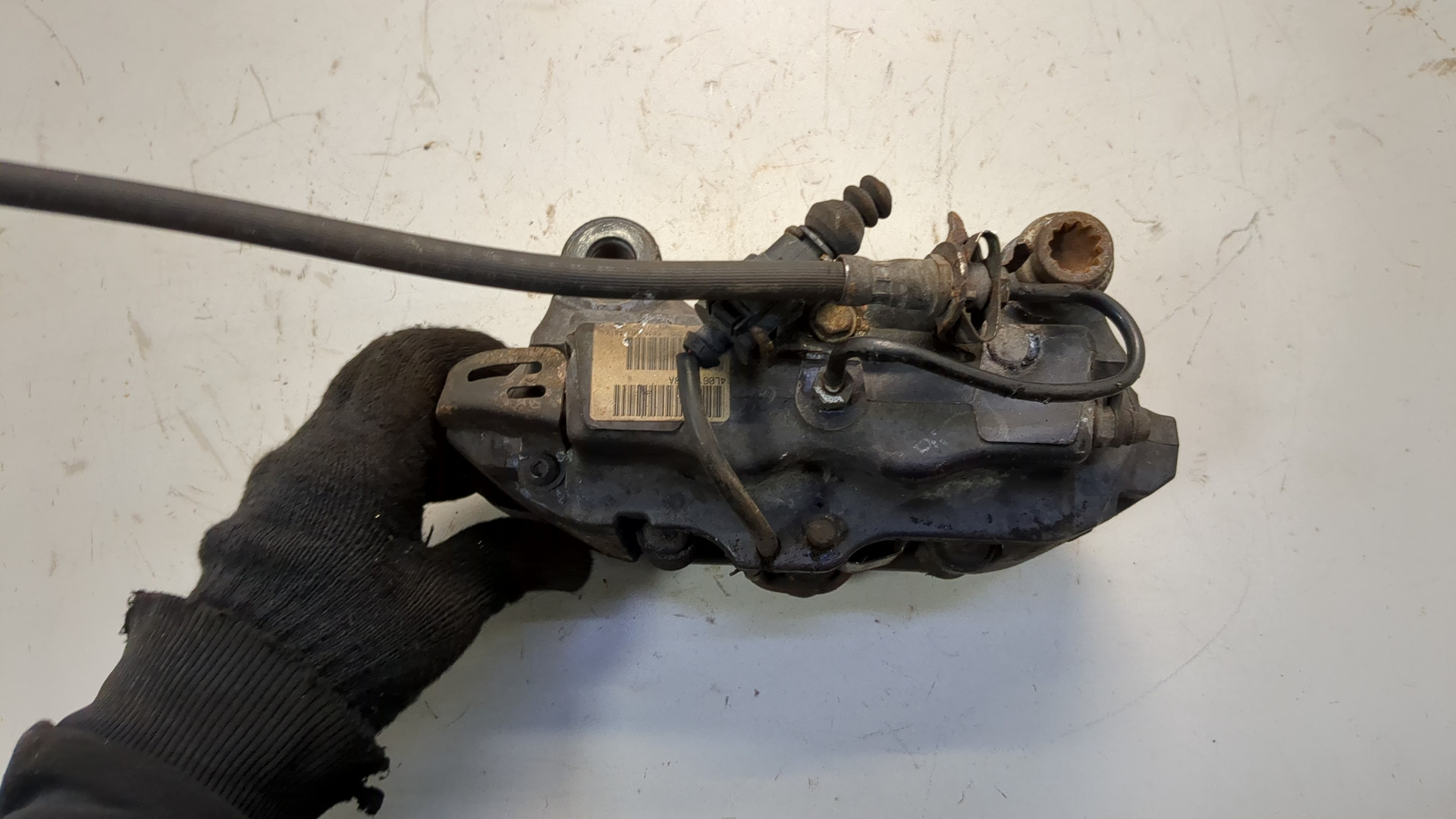 Суппорт задний левый