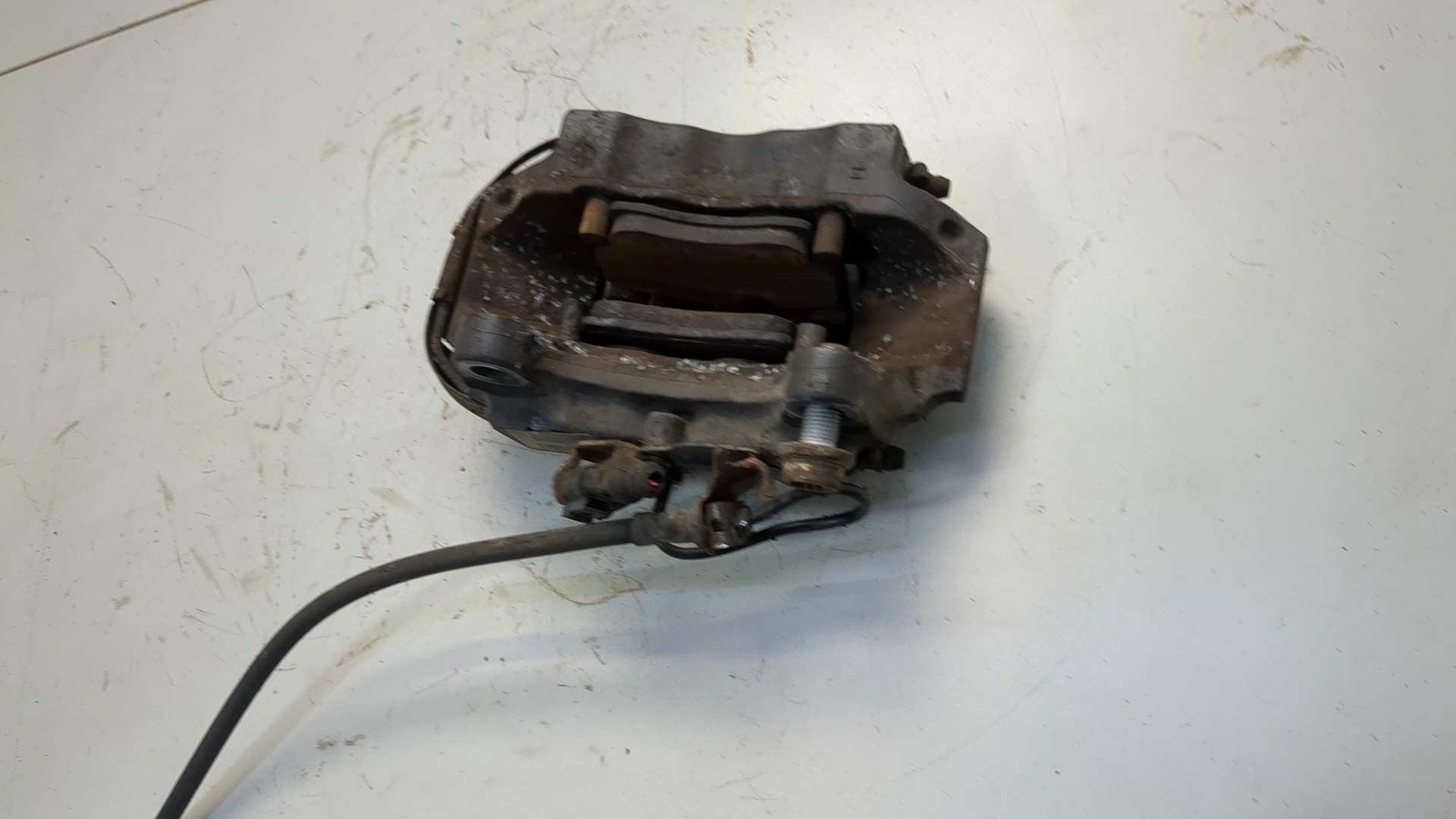 Суппорт задний левый