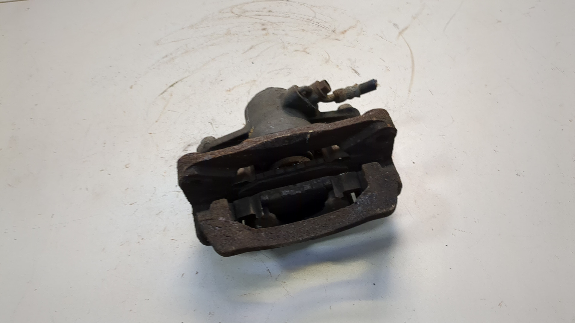 Суппорт задний левый