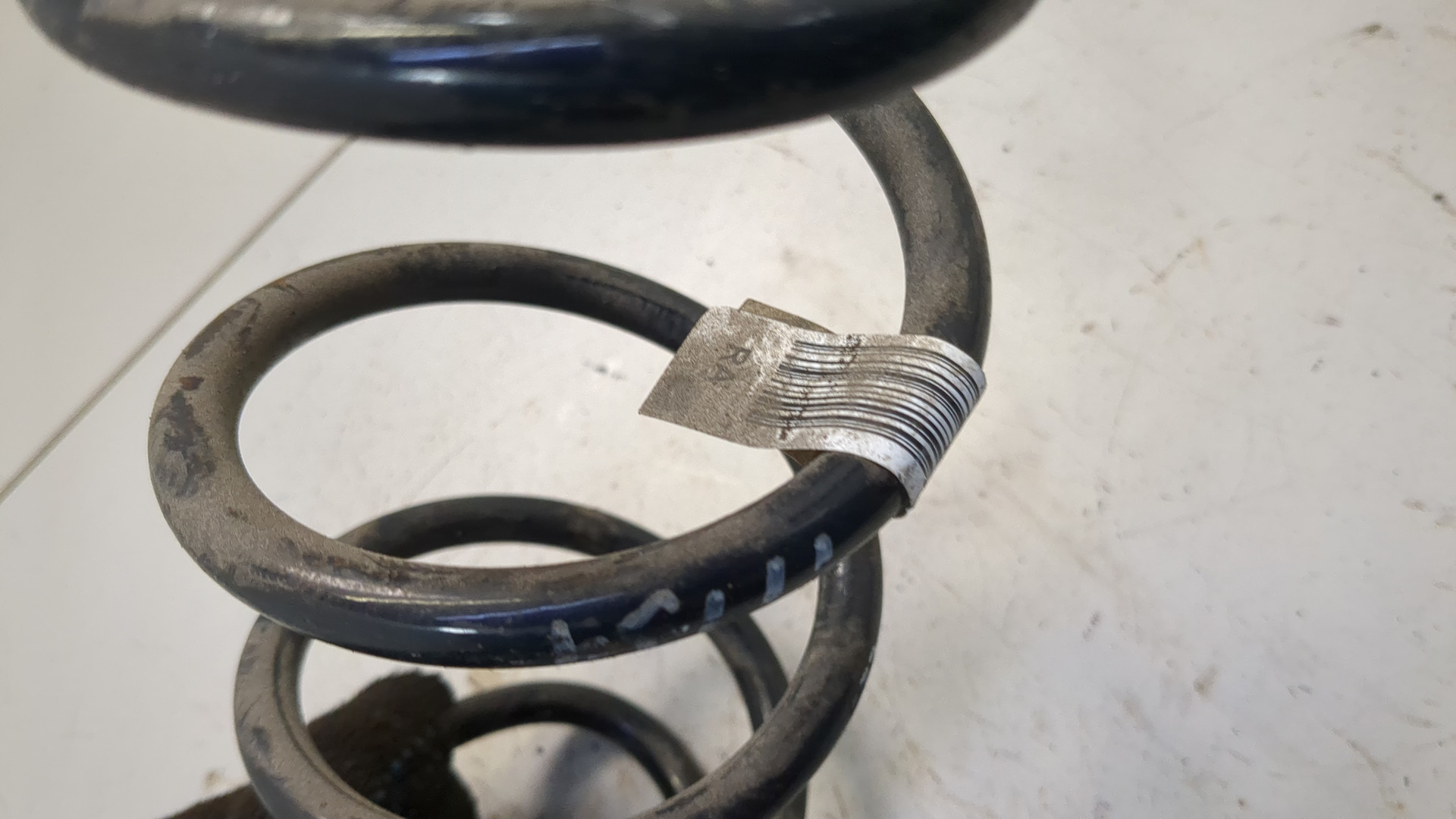 Пружина задняя