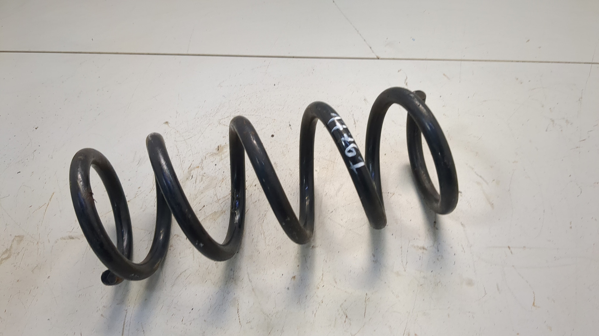 Пружина задняя