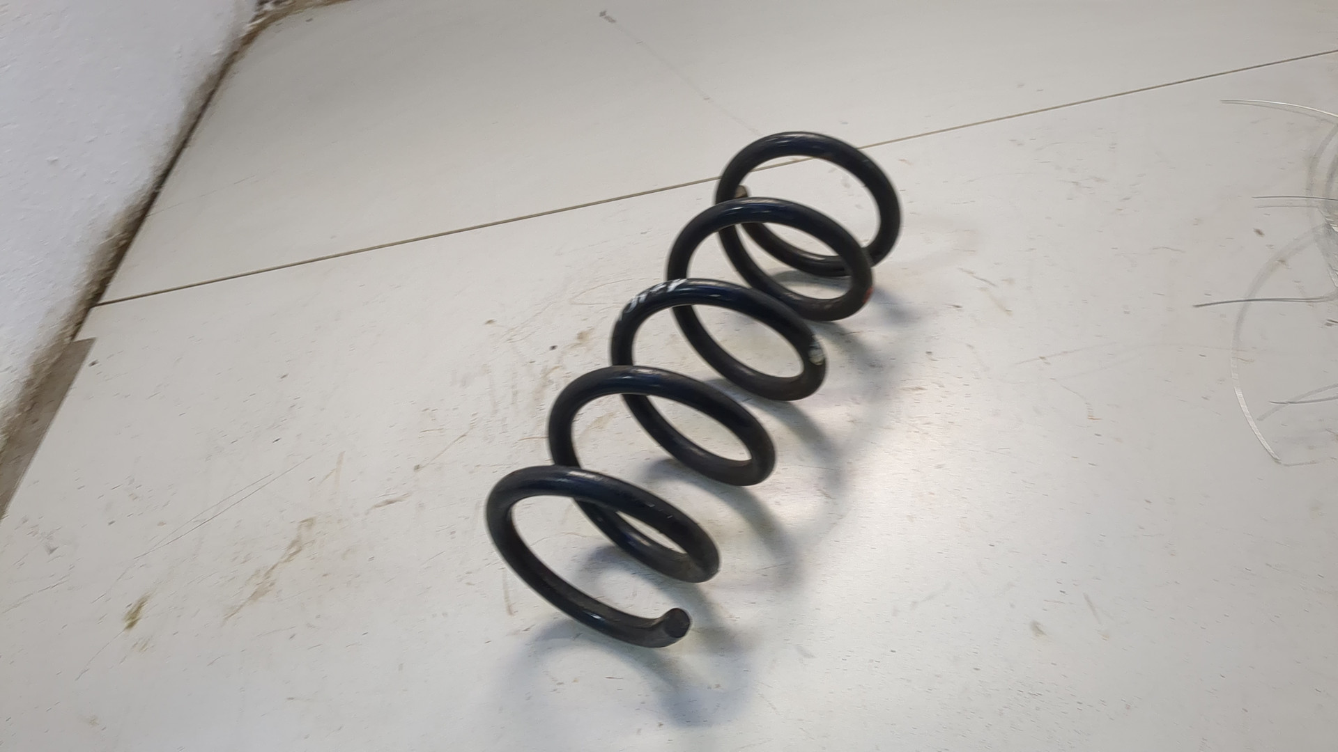 Пружина задняя