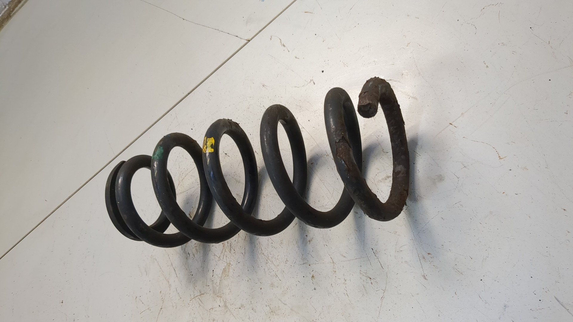 Пружина задняя