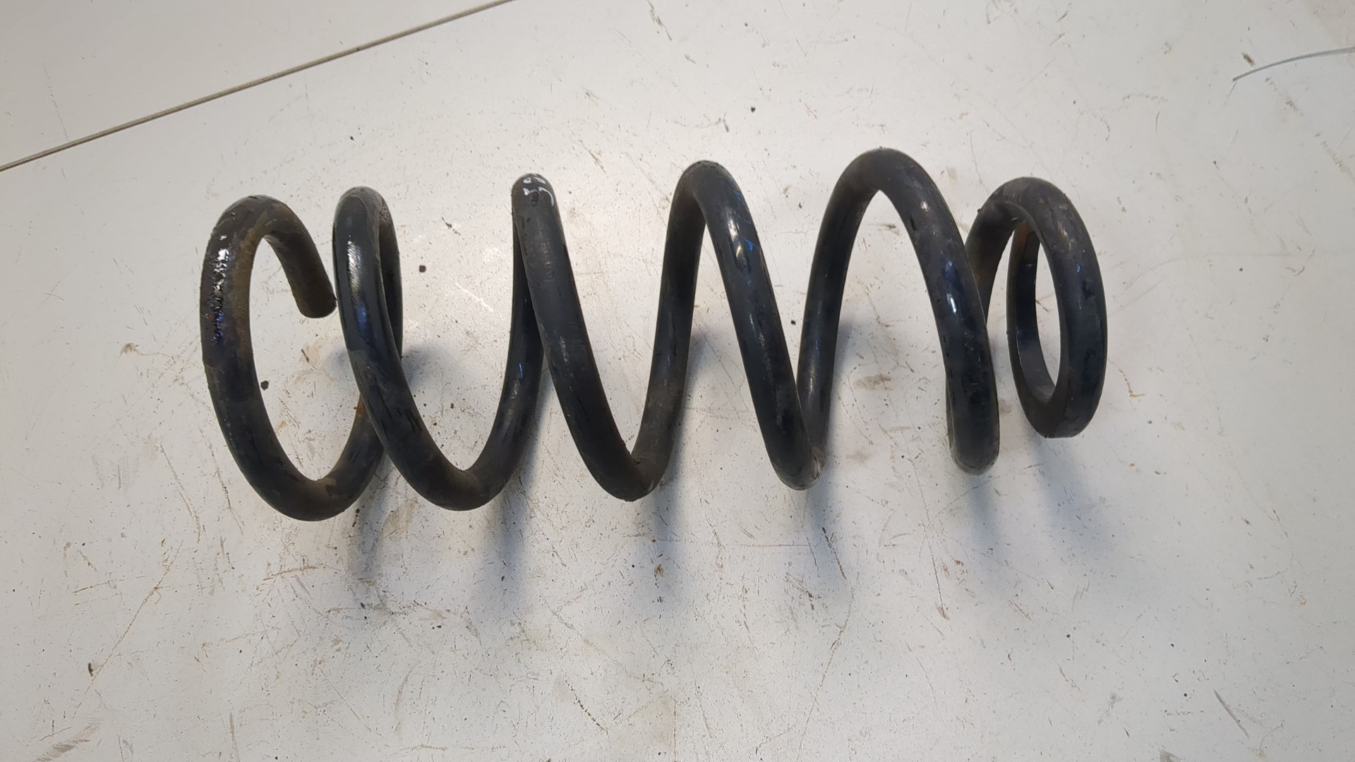 Пружина задняя