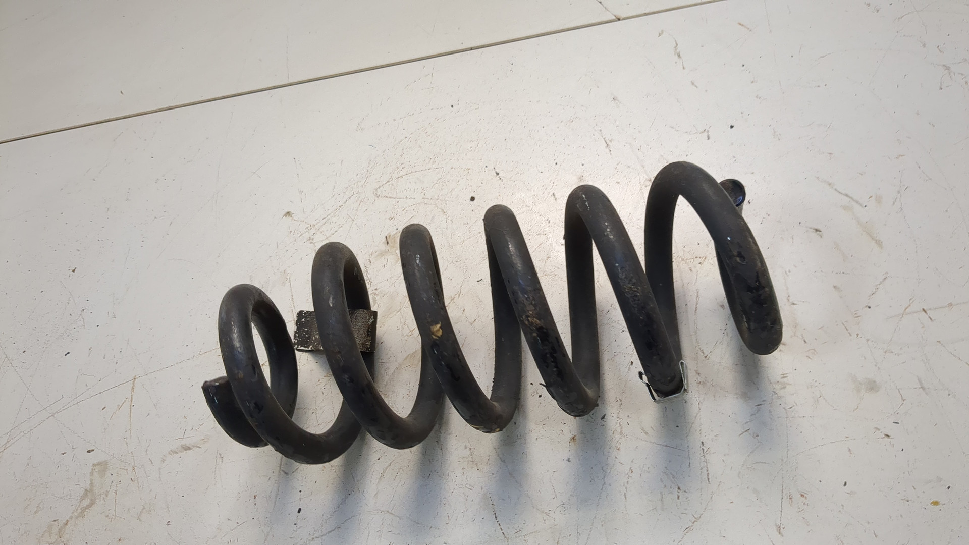 Пружина задняя