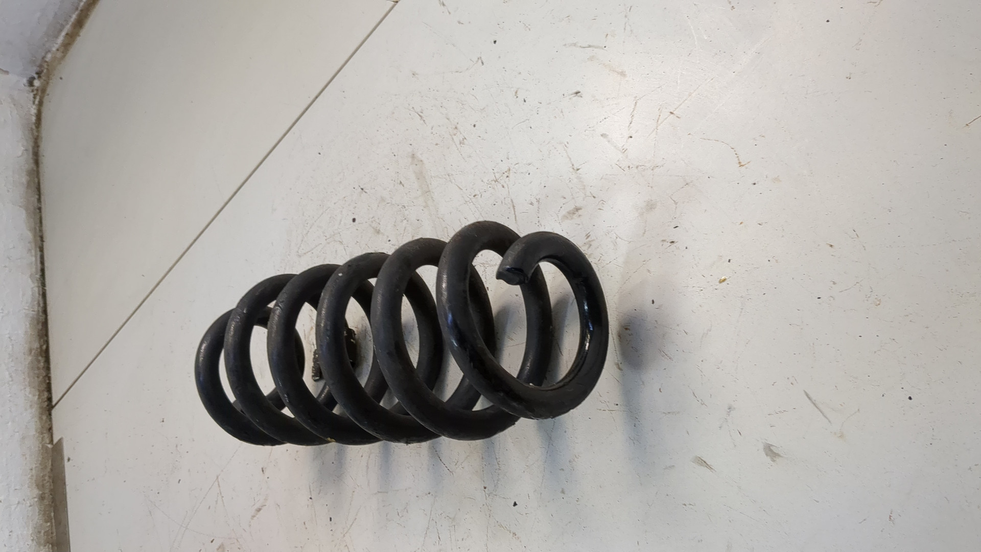 Пружина задняя