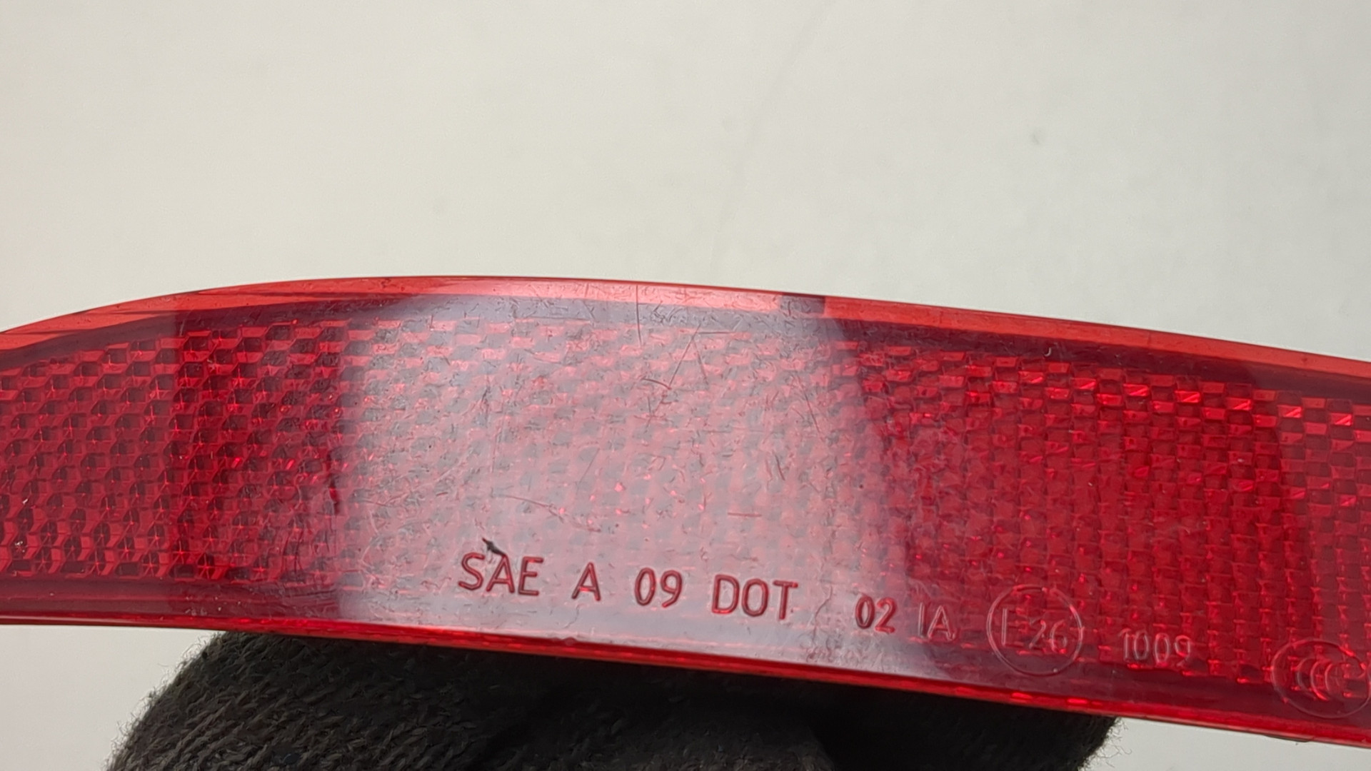 Отражатель в бампер задний левый