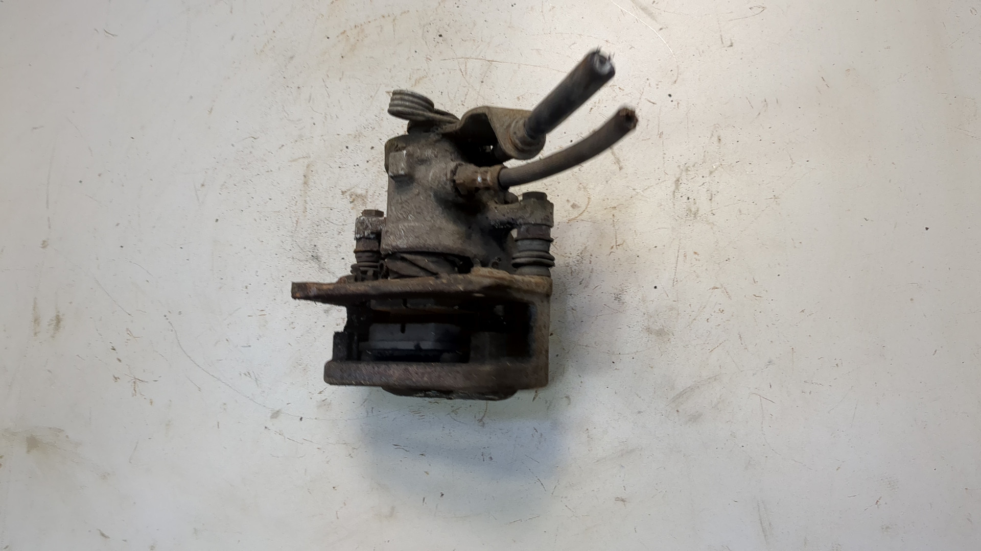 Суппорт задний левый