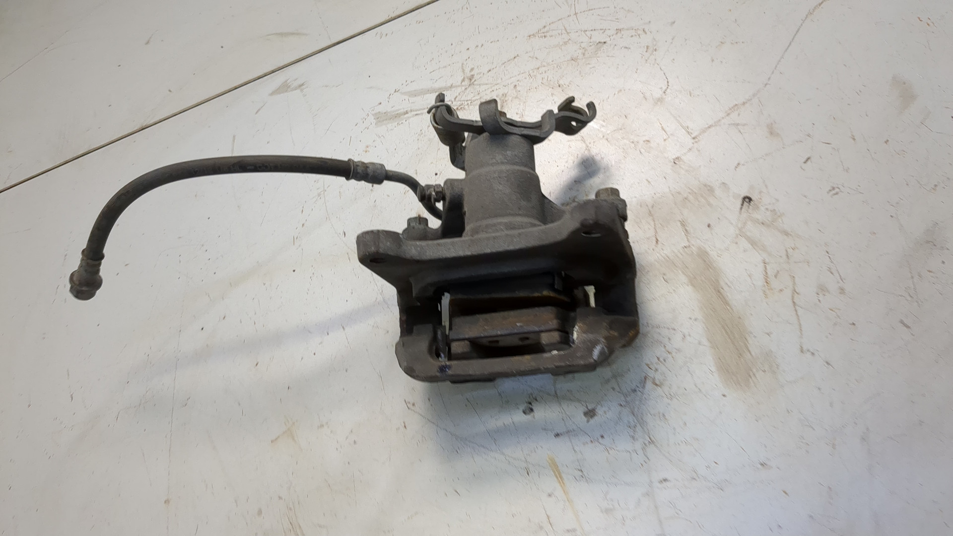 Суппорт задний левый