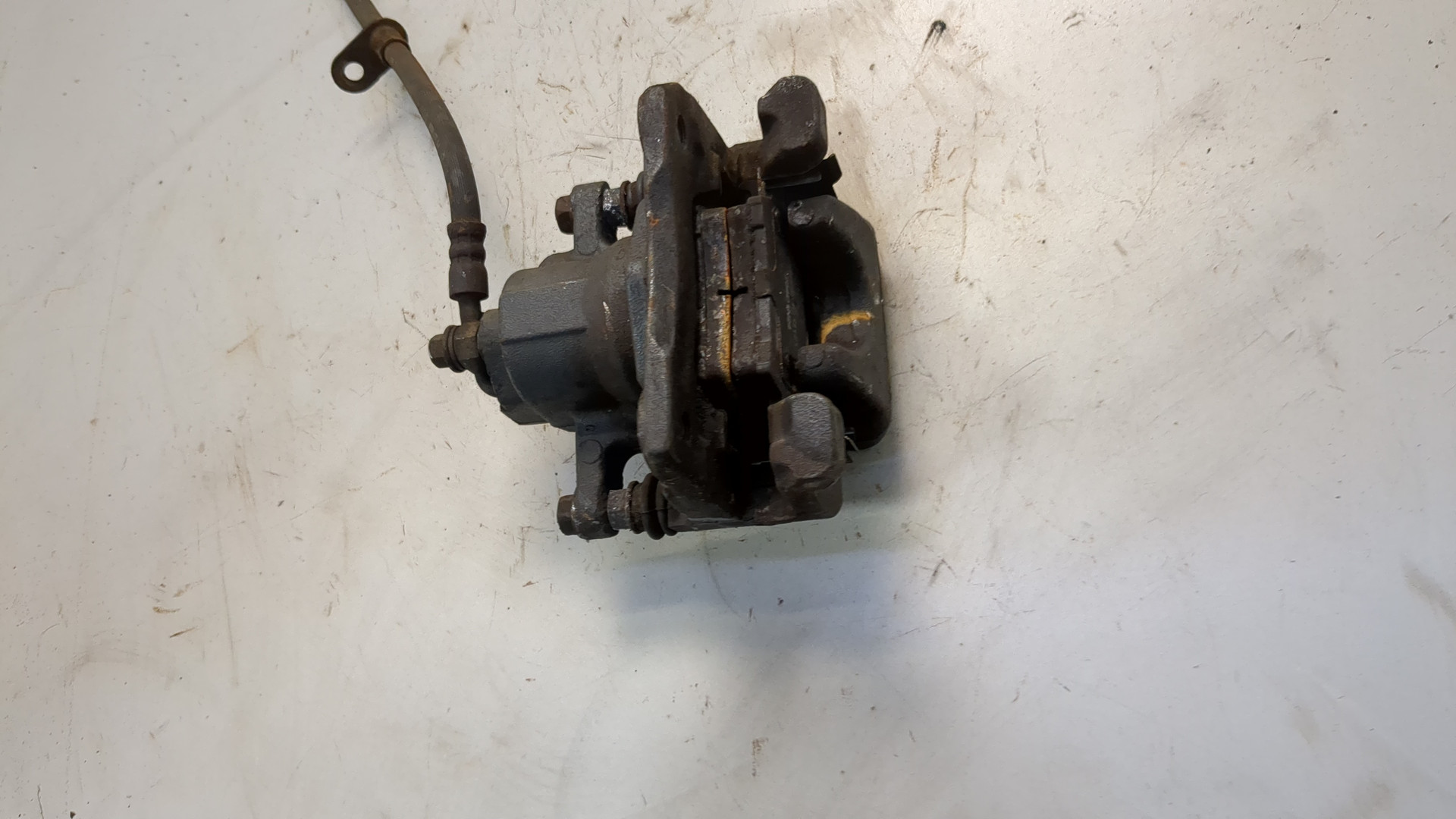 Суппорт задний левый