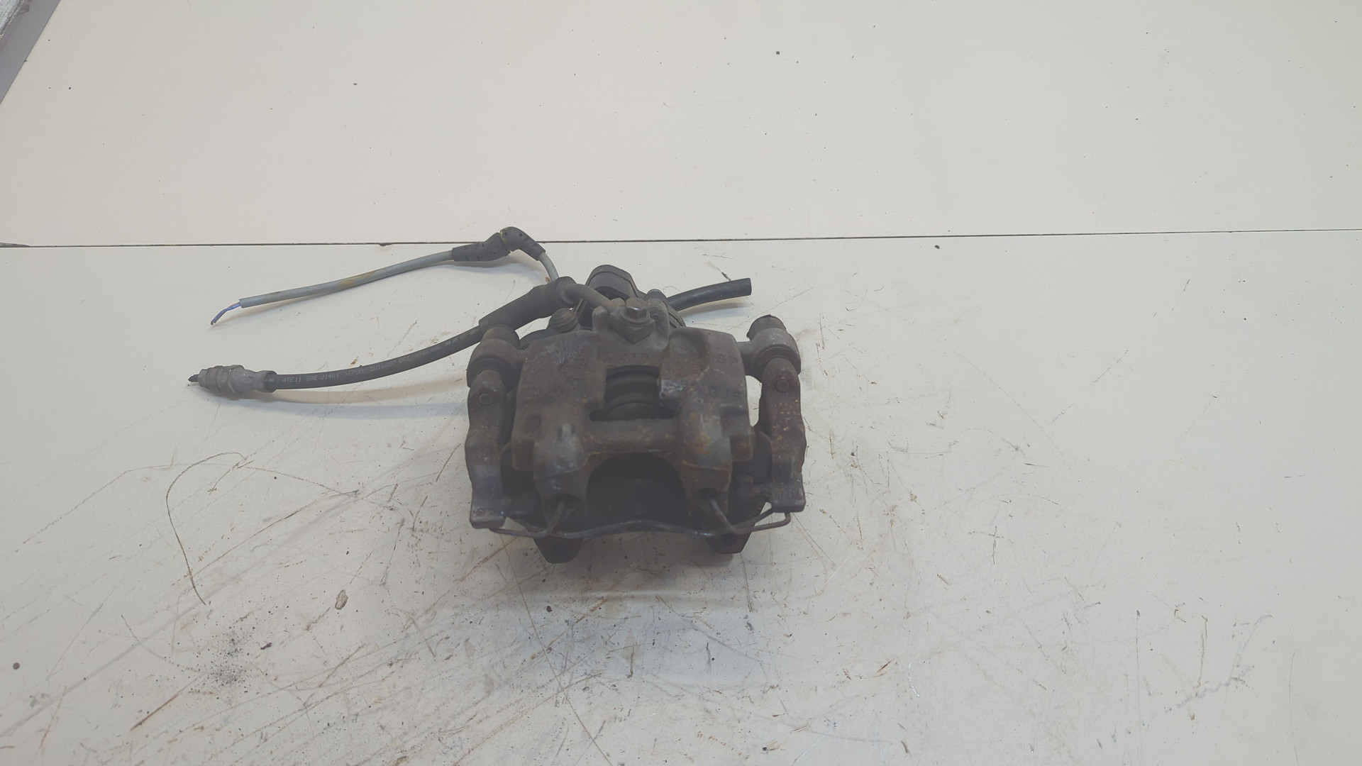 Суппорт задний левый