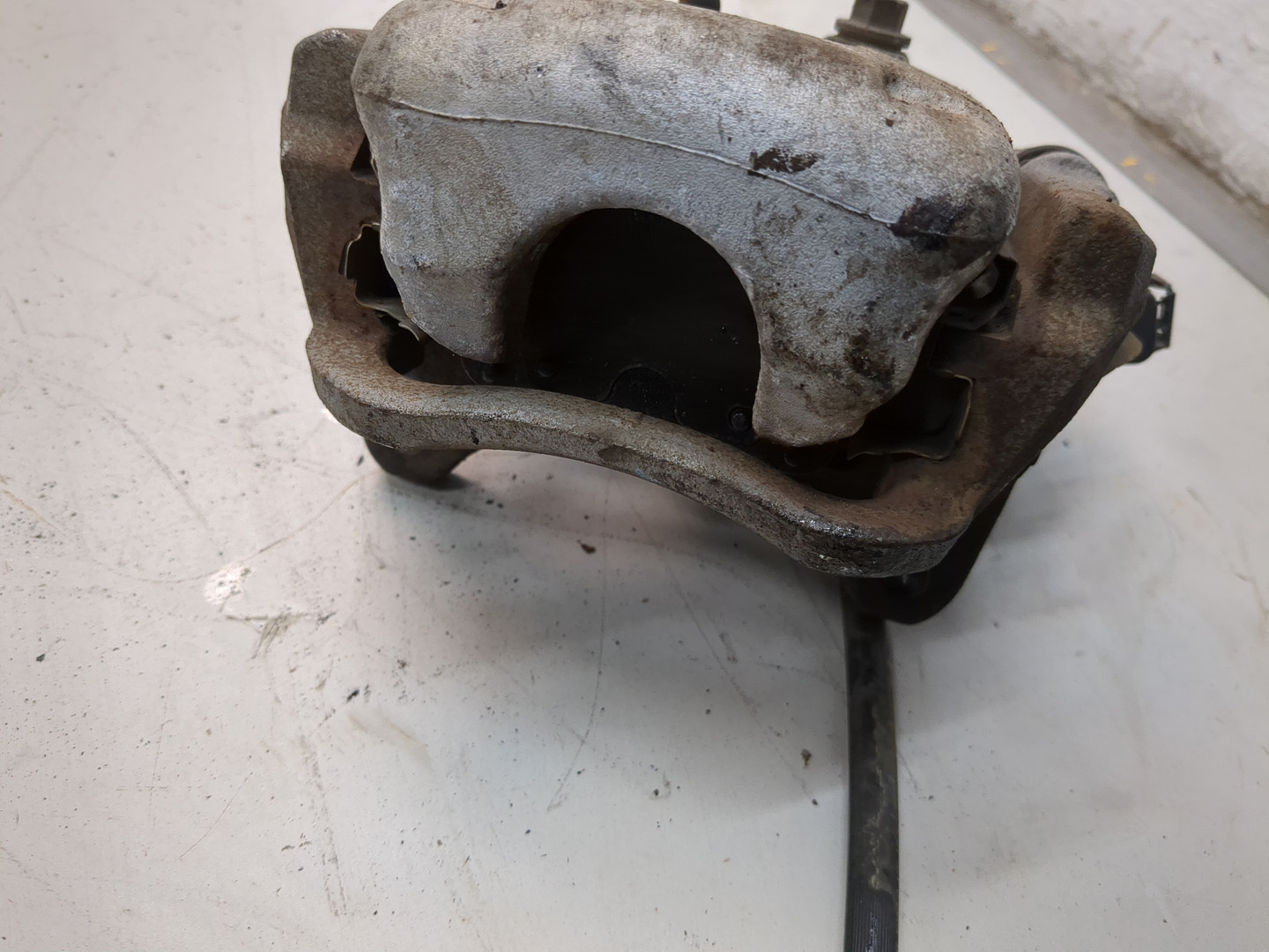 Суппорт задний левый