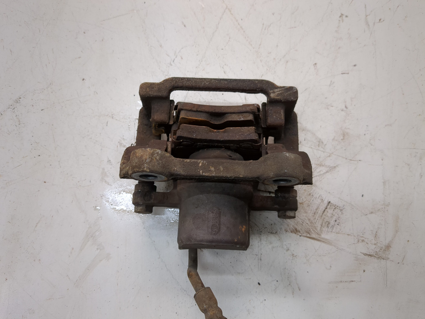 Суппорт задний левый