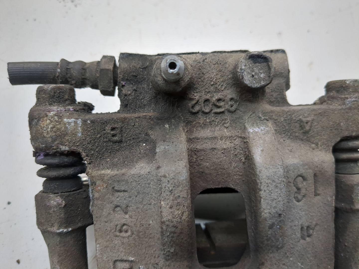 Суппорт задний левый