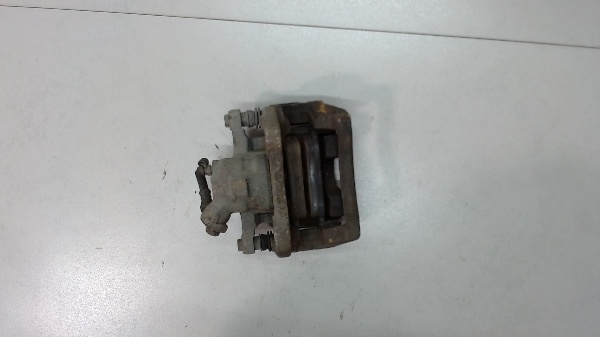 Суппорт задний левый