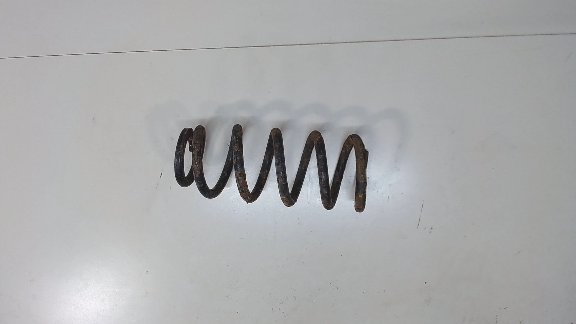 Пружина задняя