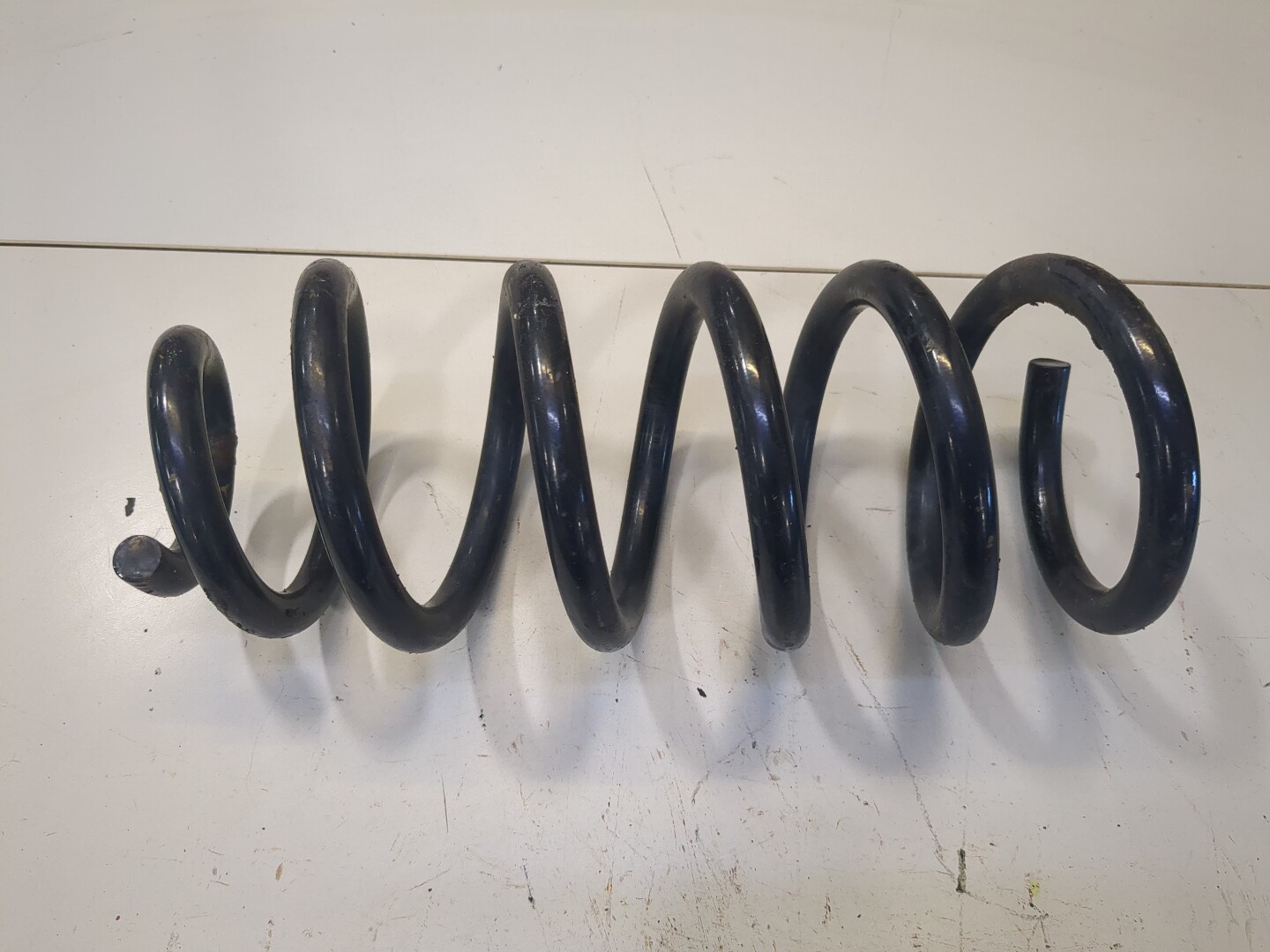 Пружина задняя