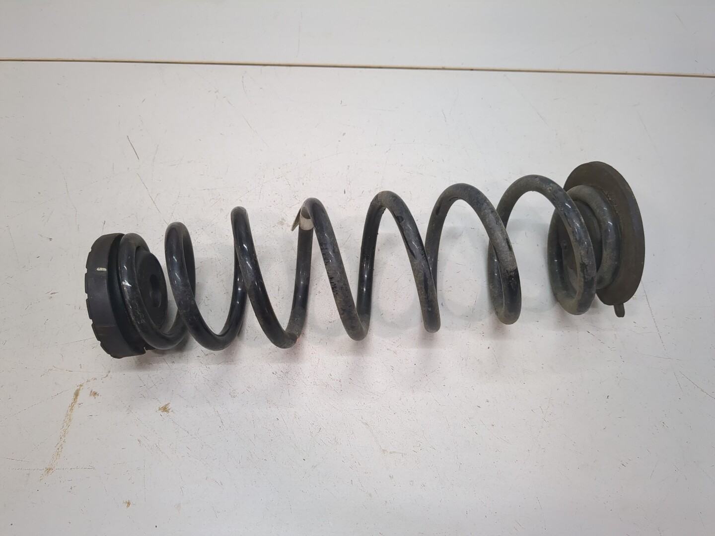 Пружина задняя