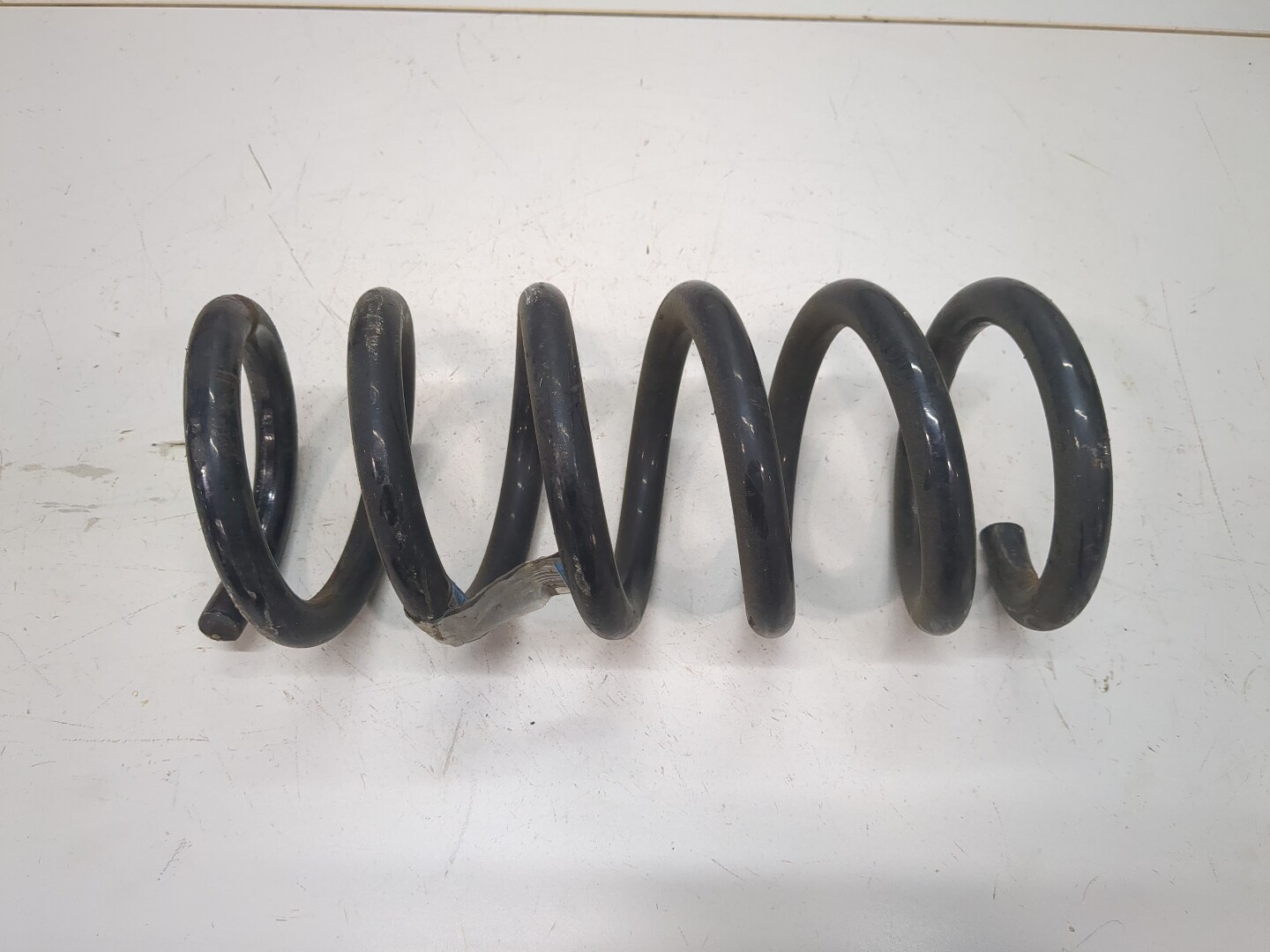 Пружина задняя