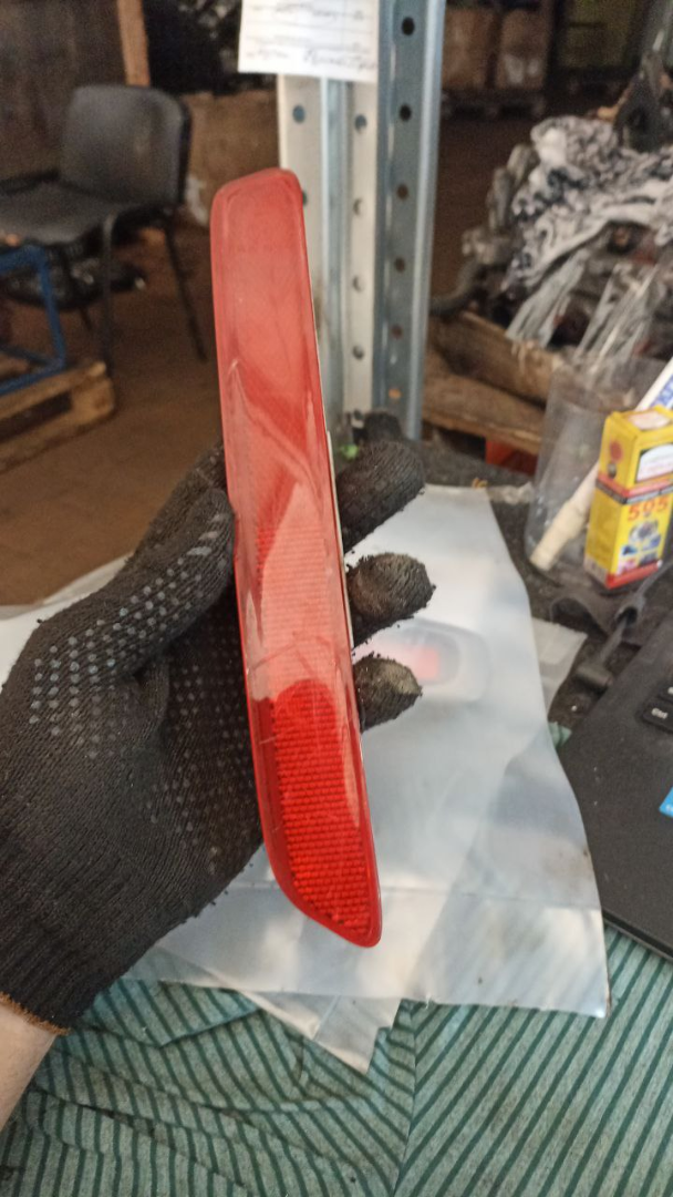 Отражатель в бампер задний левый