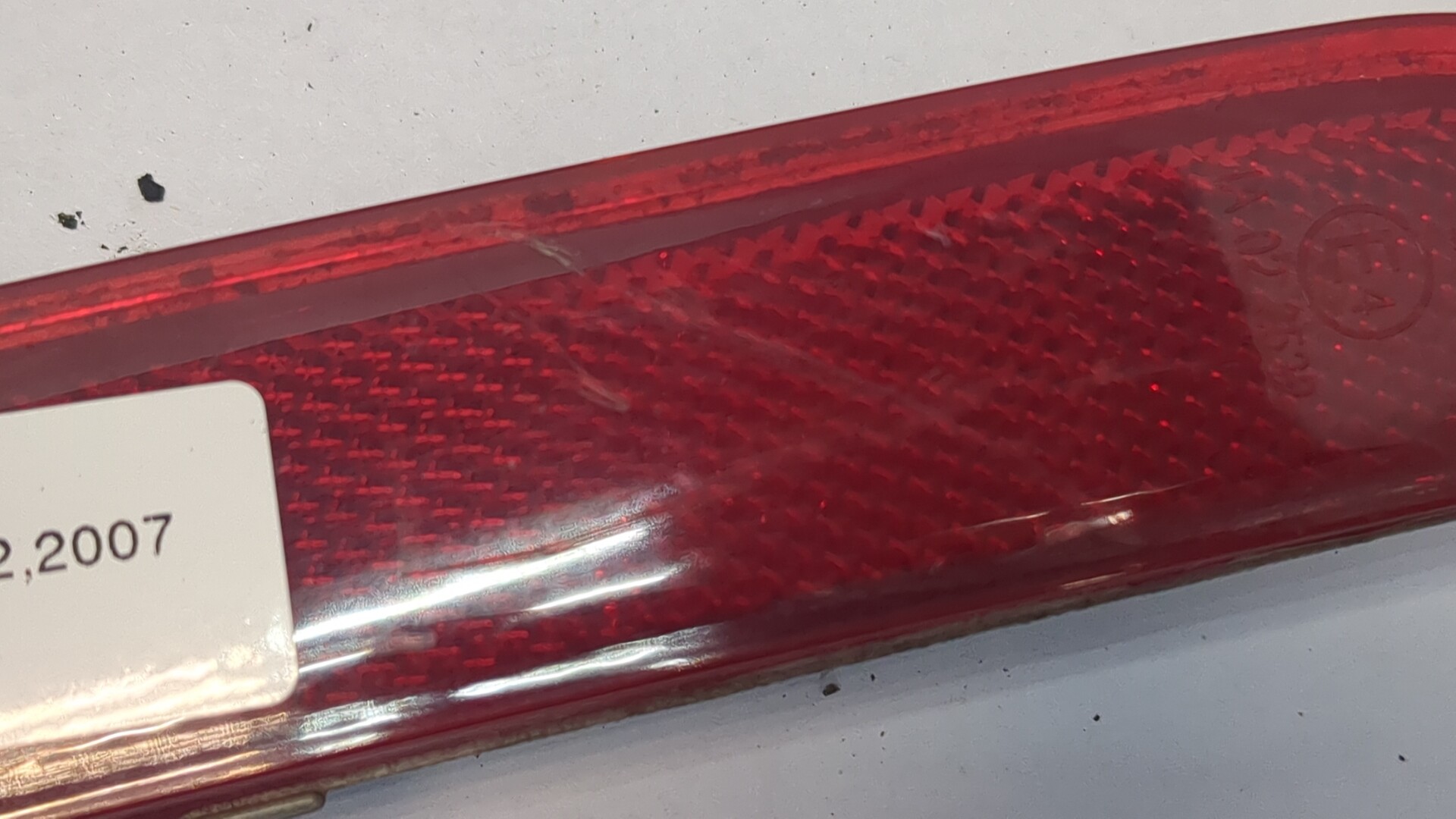 Отражатель в бампер задний левый