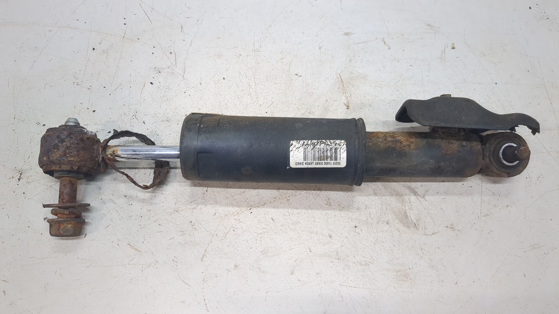 Амортизатор задний левый