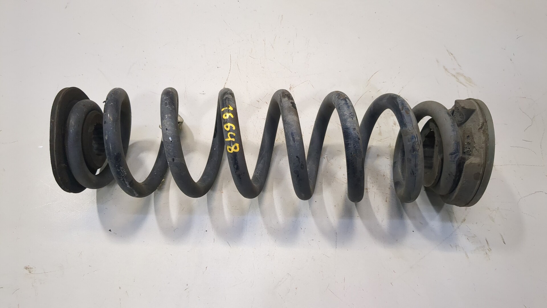 Пружина задняя