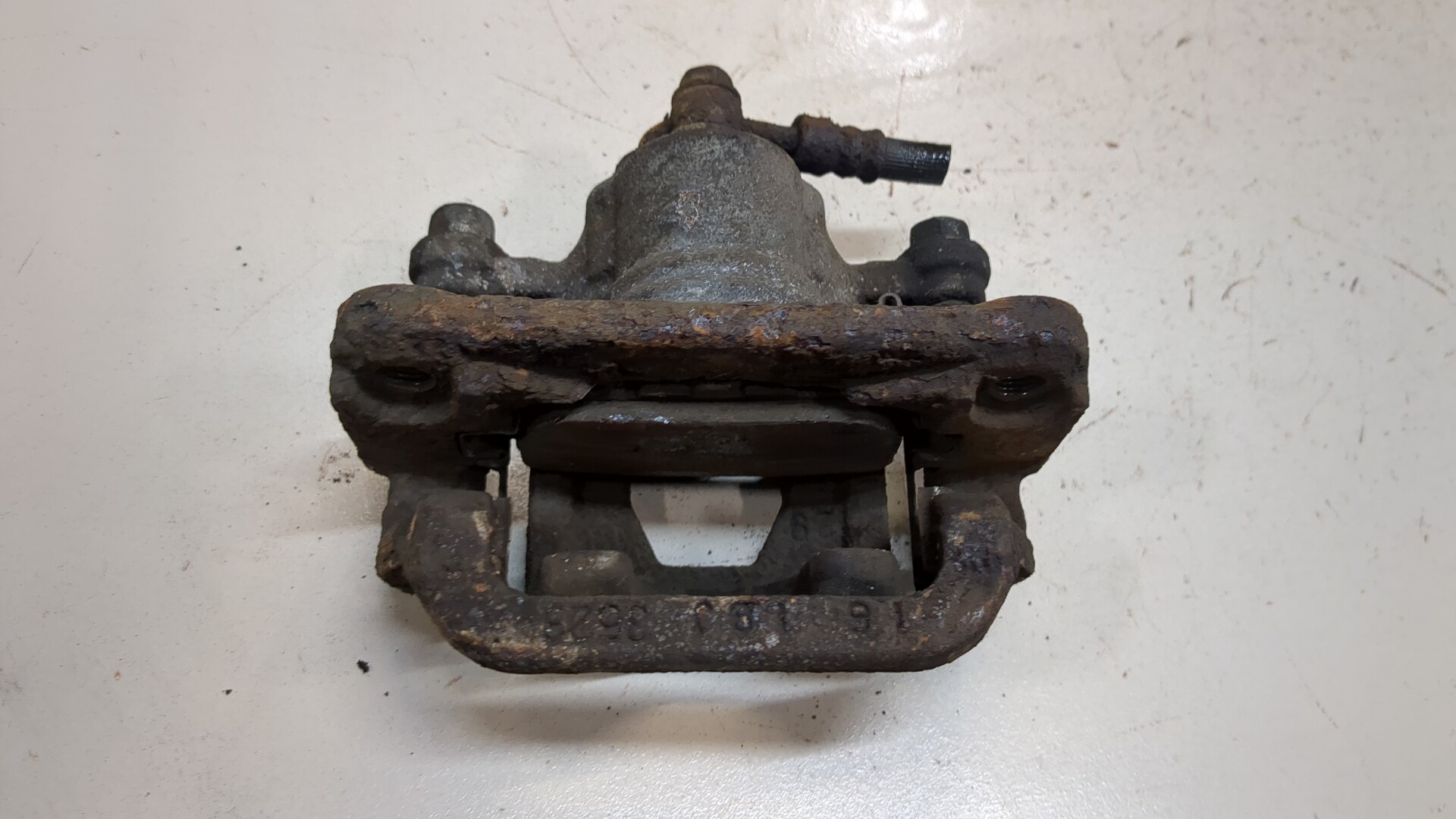 Суппорт задний левый