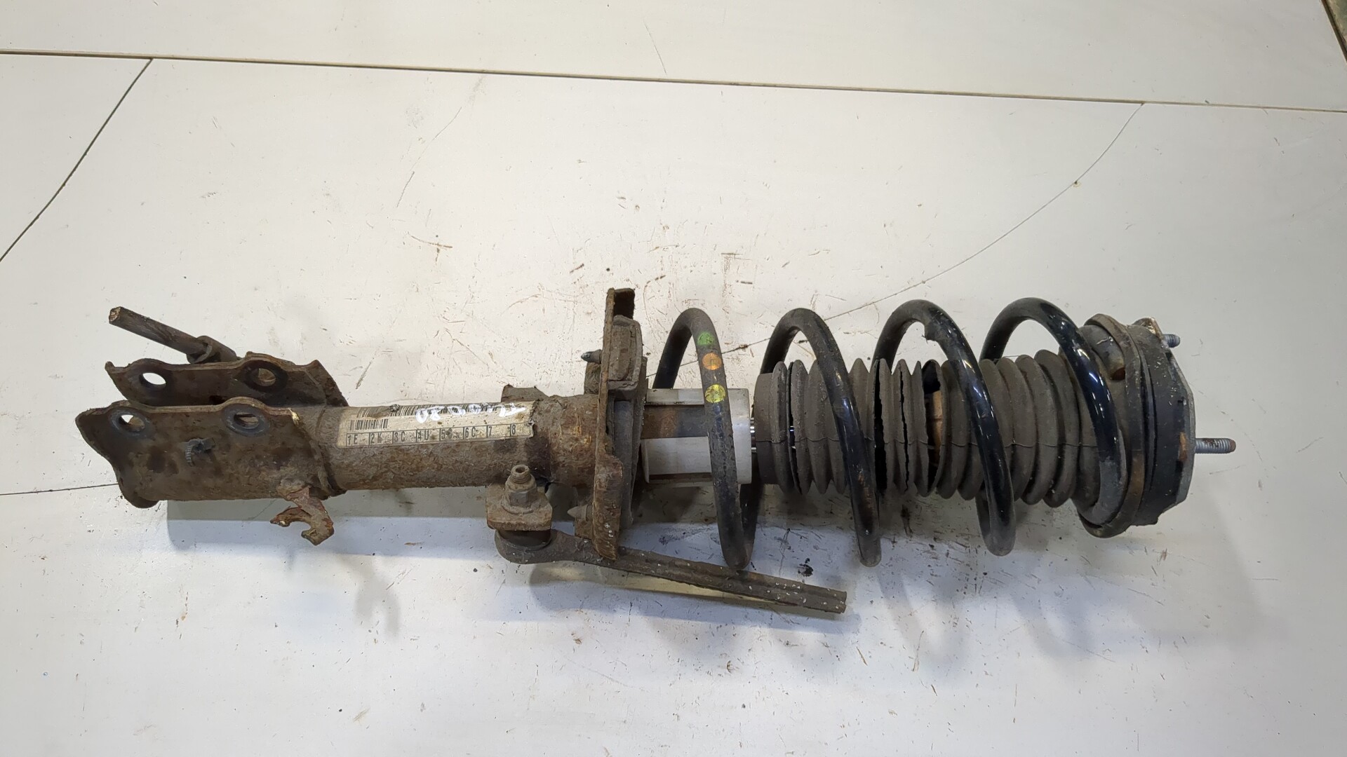 Амортизатор передний левый