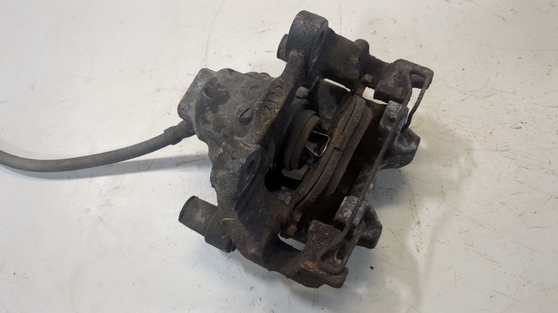 Суппорт задний левый