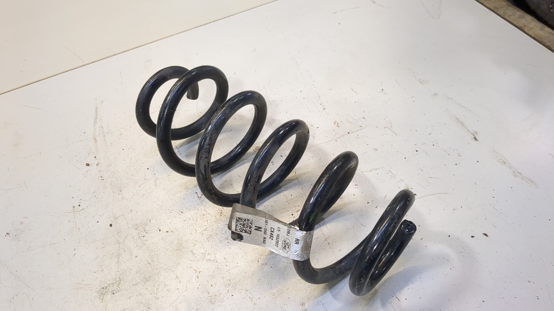 Пружина задняя