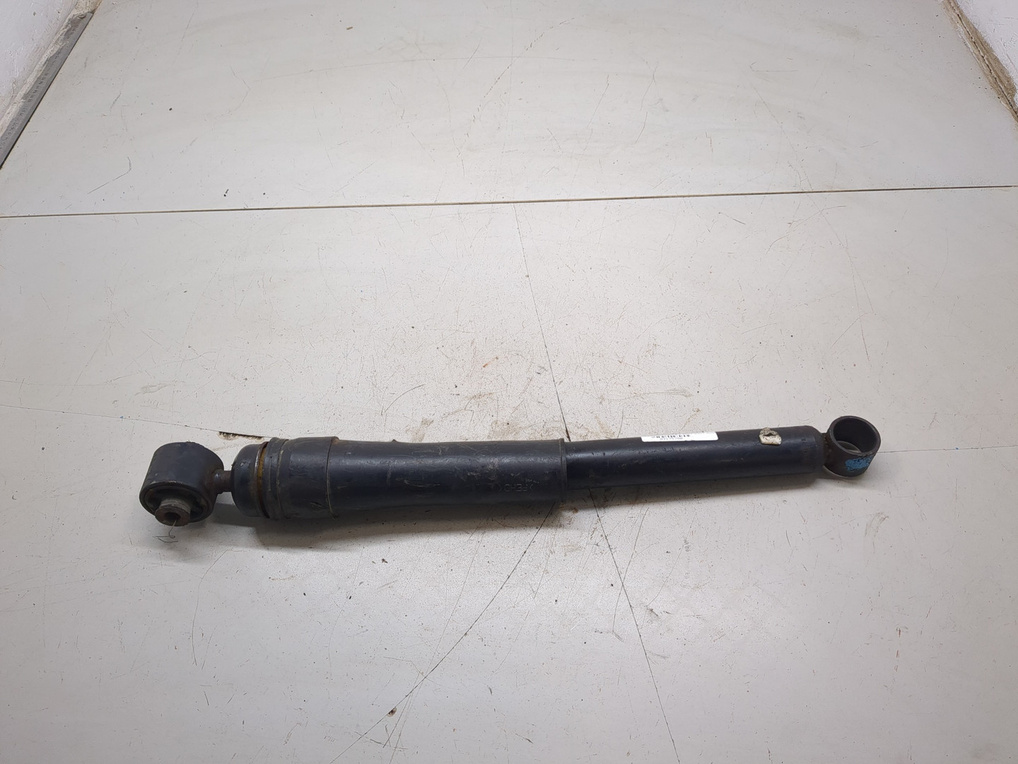 Амортизатор задний левый