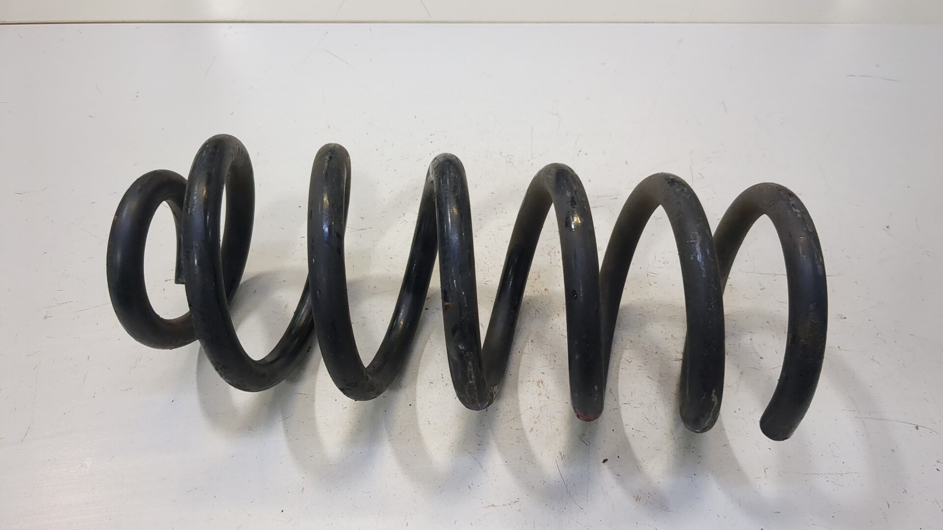 Пружина задняя