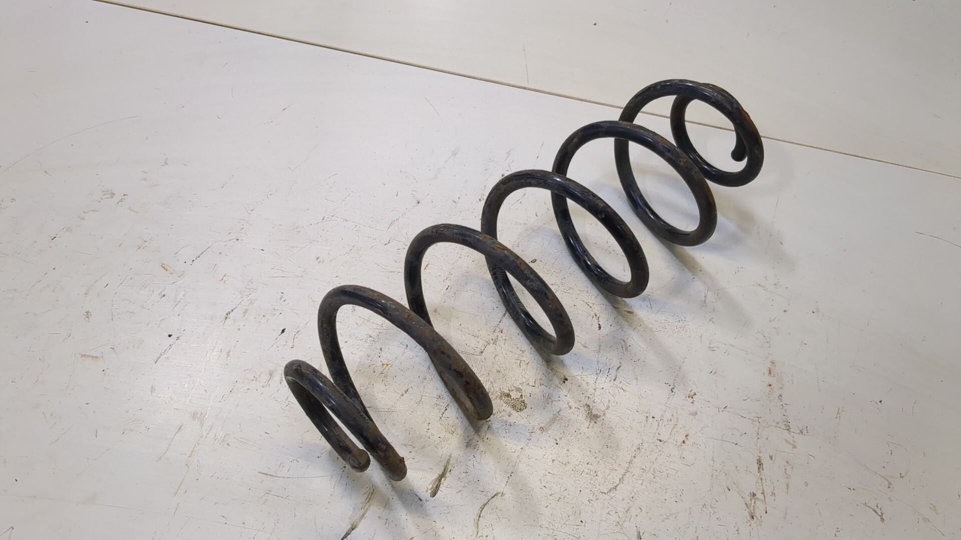 Пружина задняя