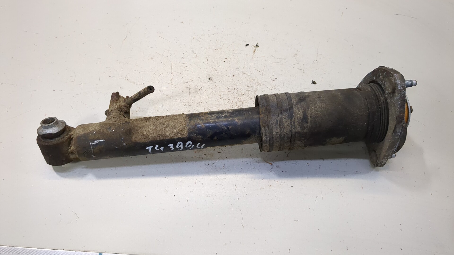 Амортизатор задний левый