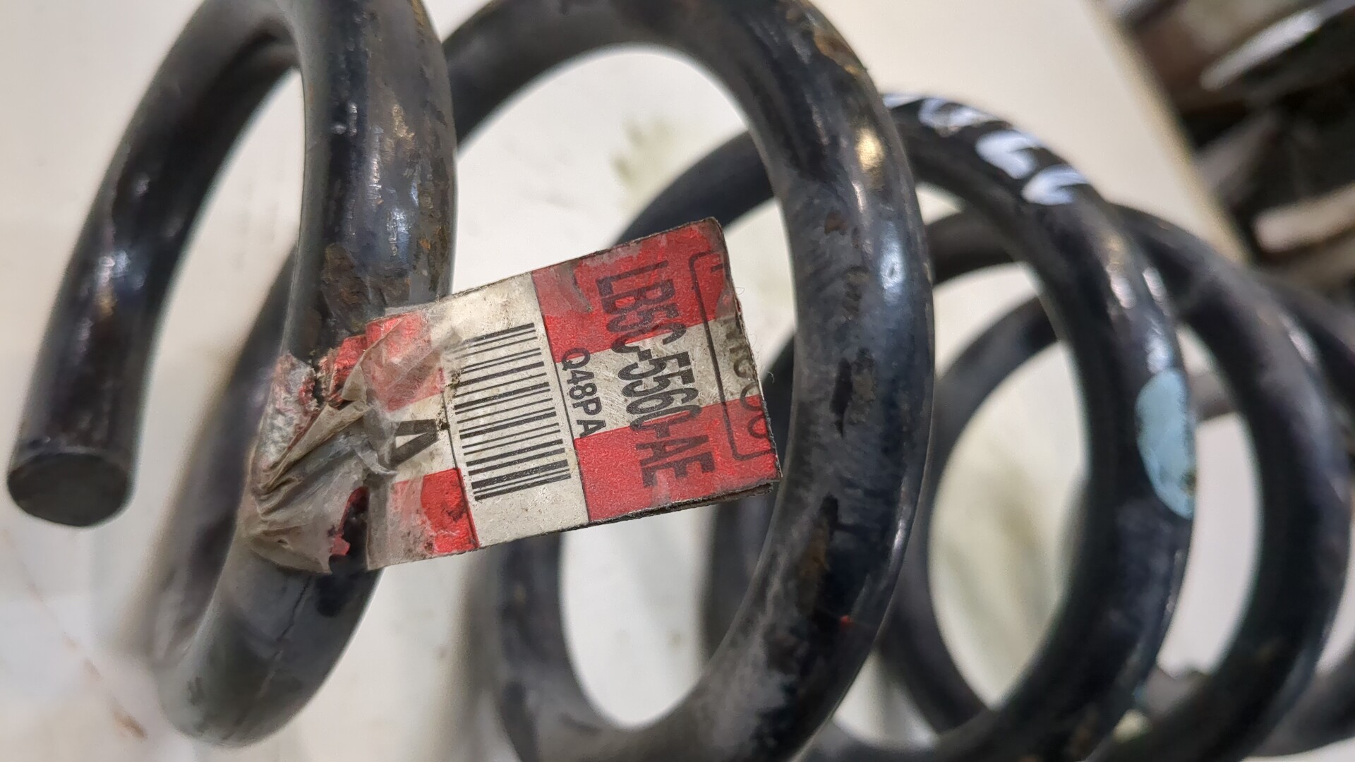 Пружина задняя