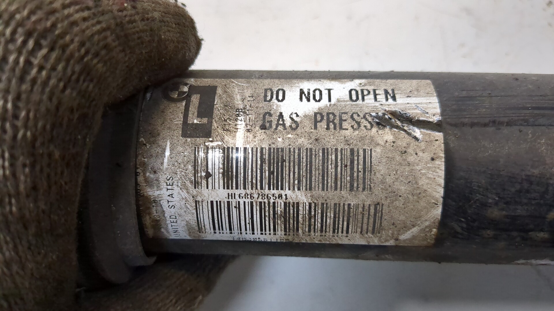 Амортизатор задний левый