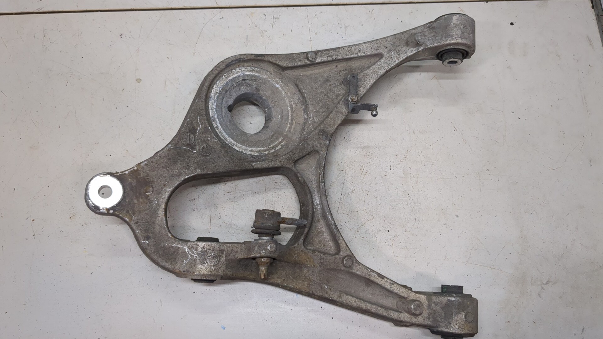 Рычаг задний левый