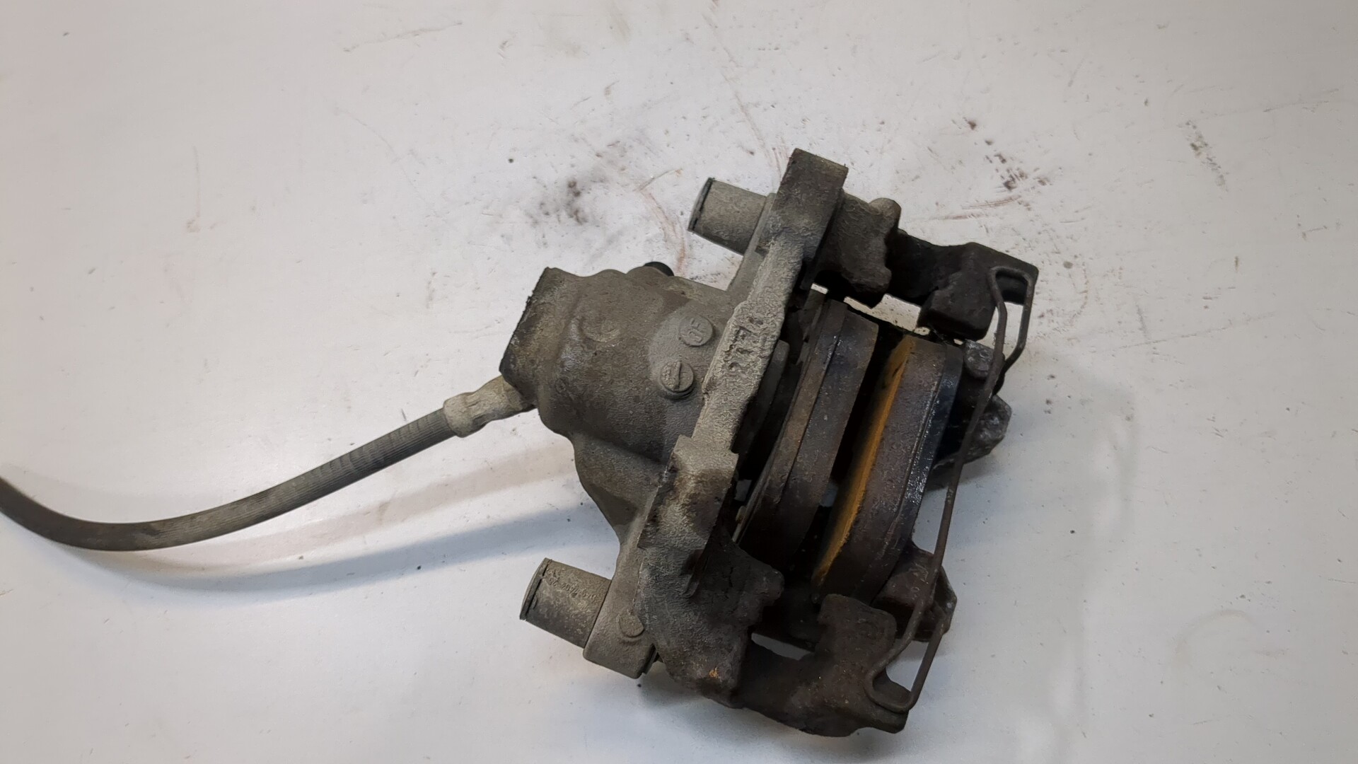 Суппорт задний левый