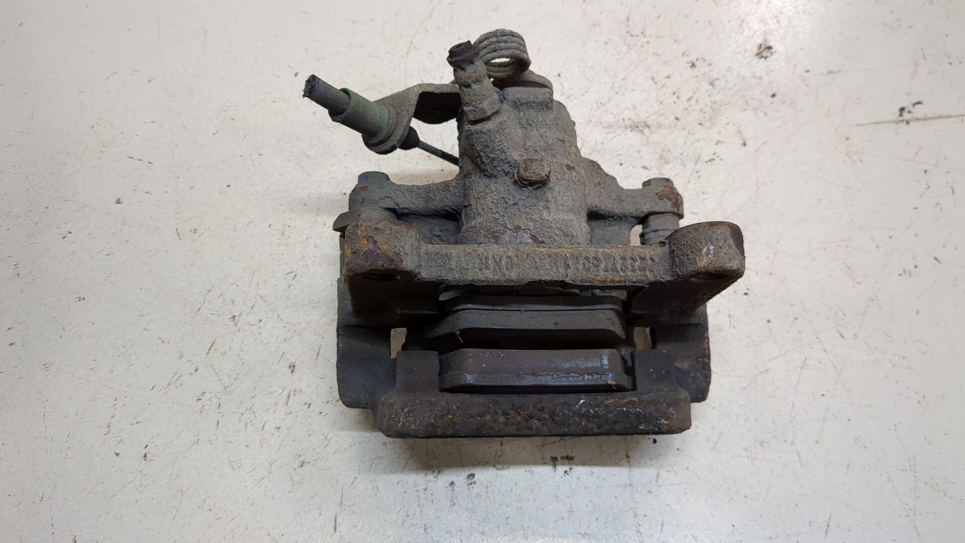 Суппорт задний левый