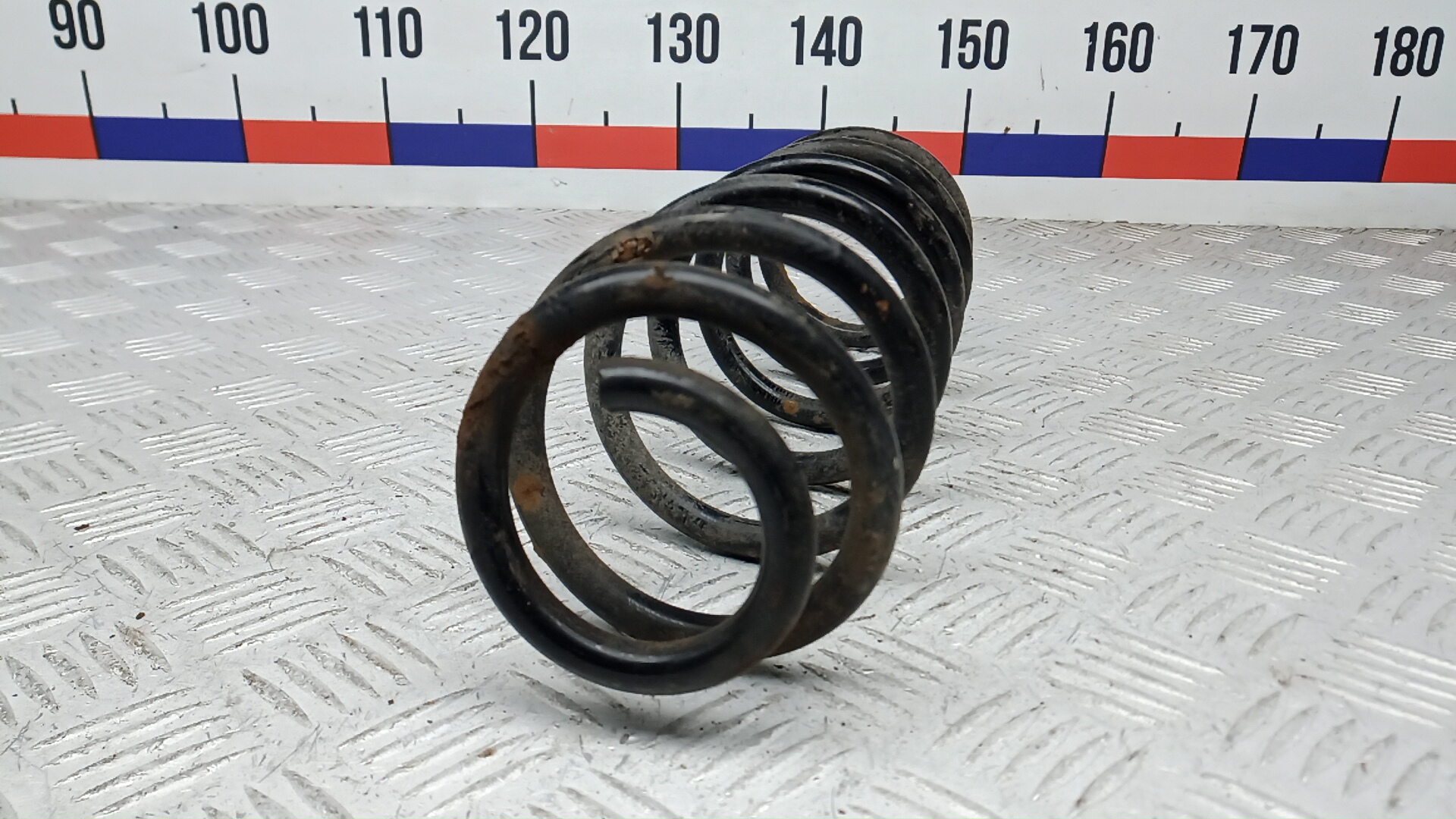 Пружина задняя