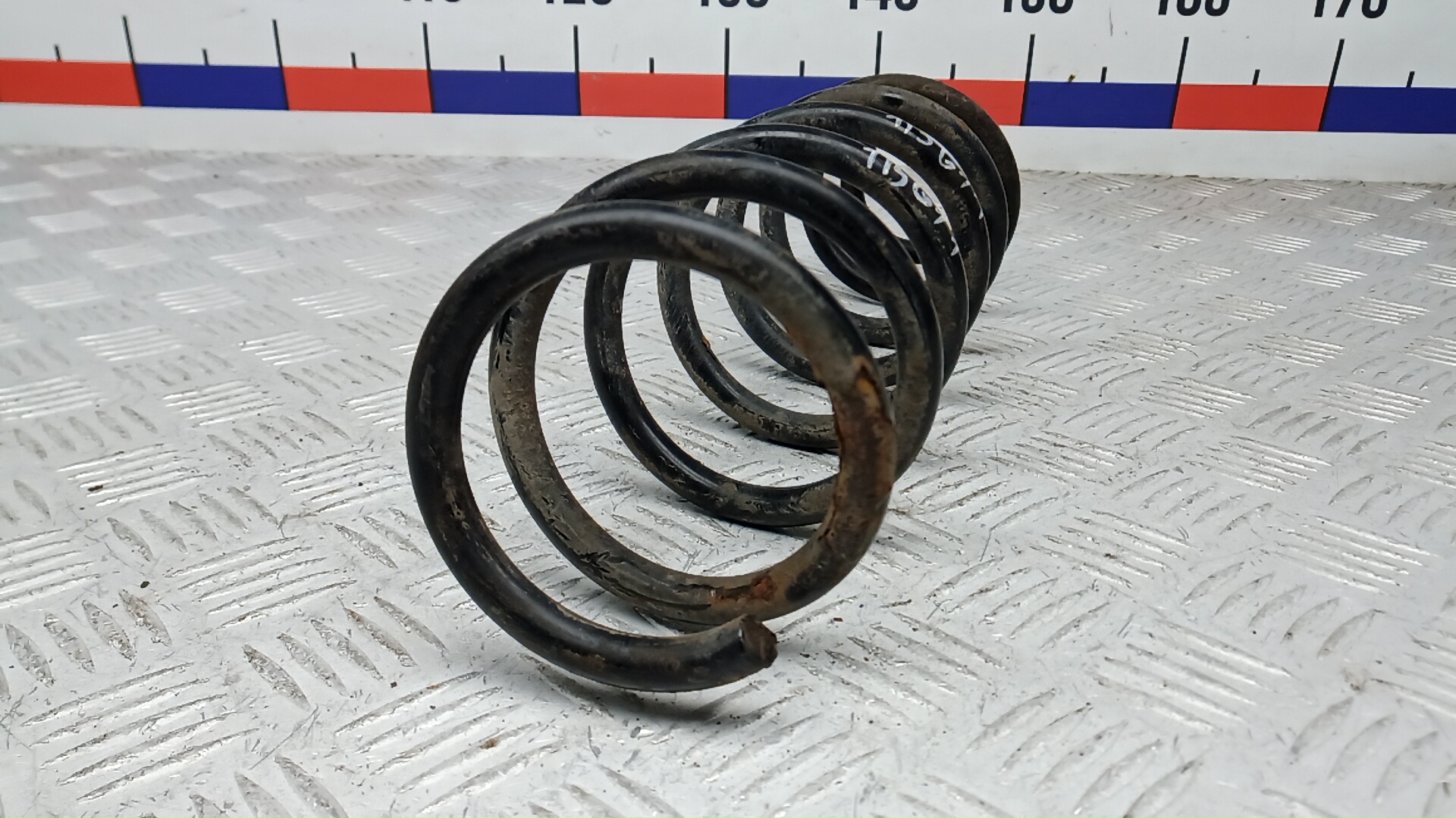 Пружина задняя