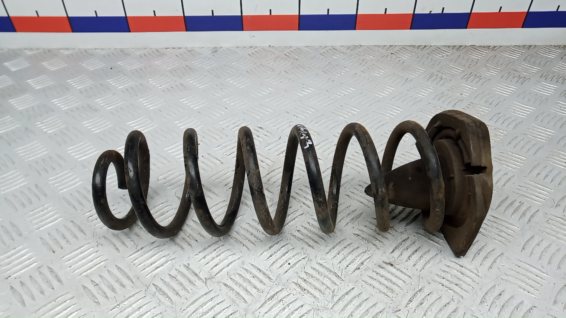 Пружина задняя