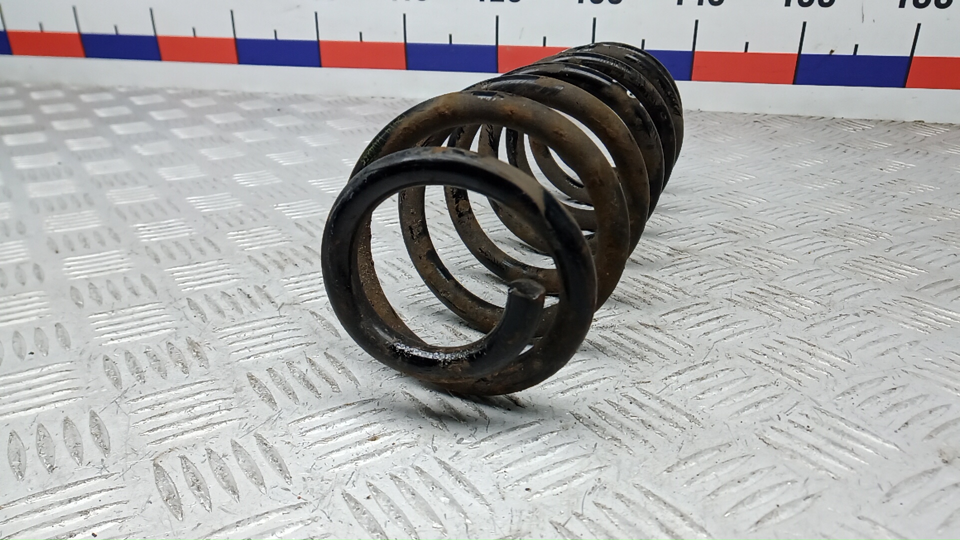 Пружина задняя