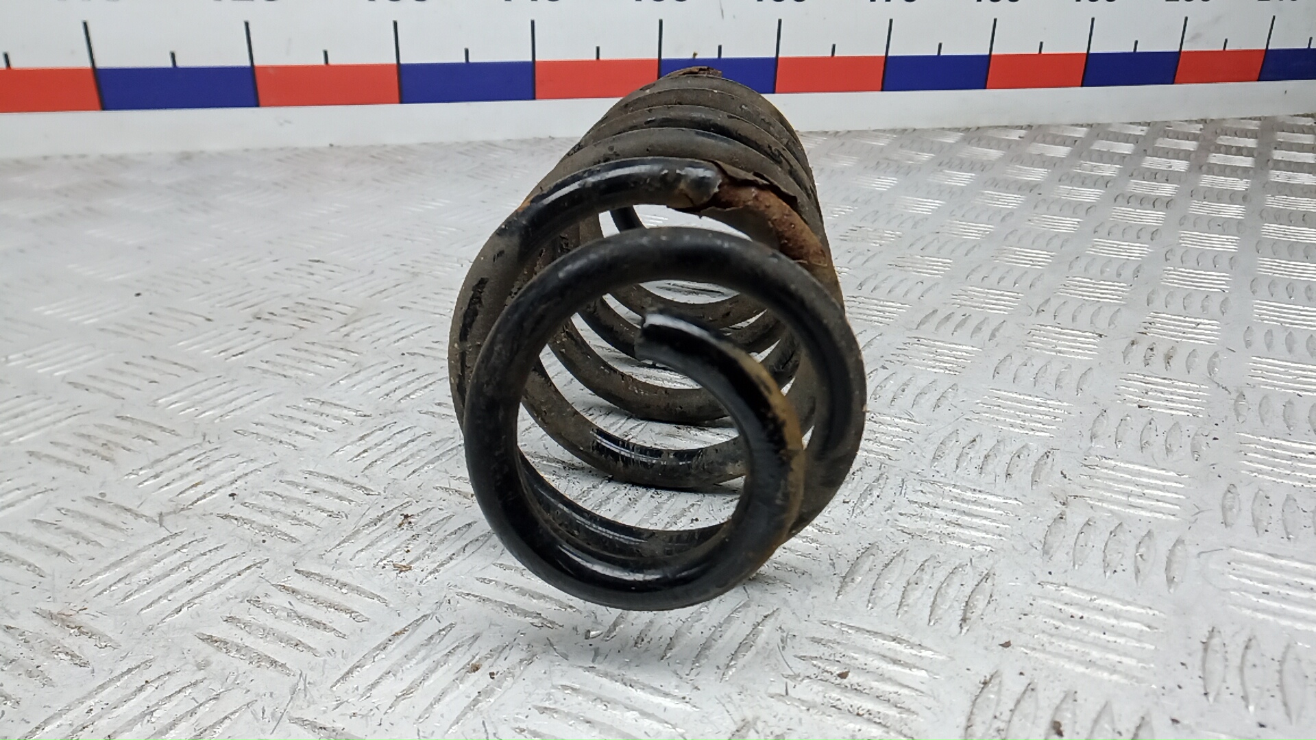 Пружина задняя