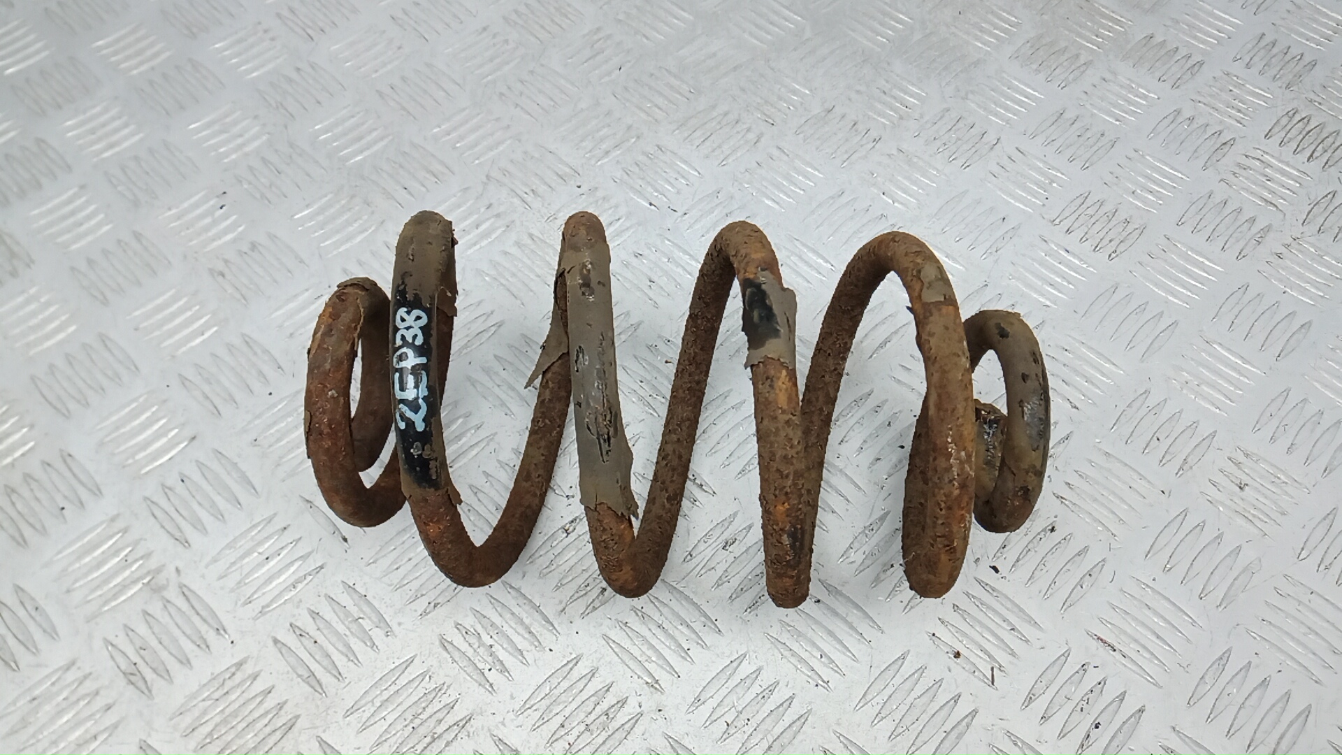 Пружина задняя