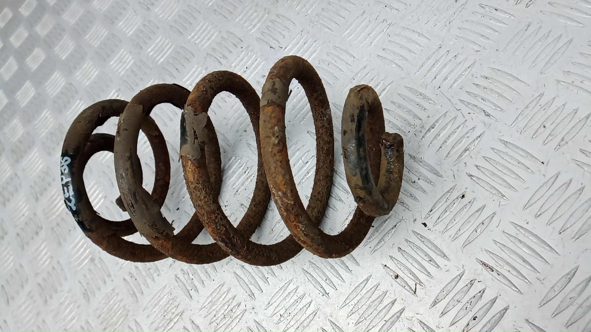 Пружина задняя