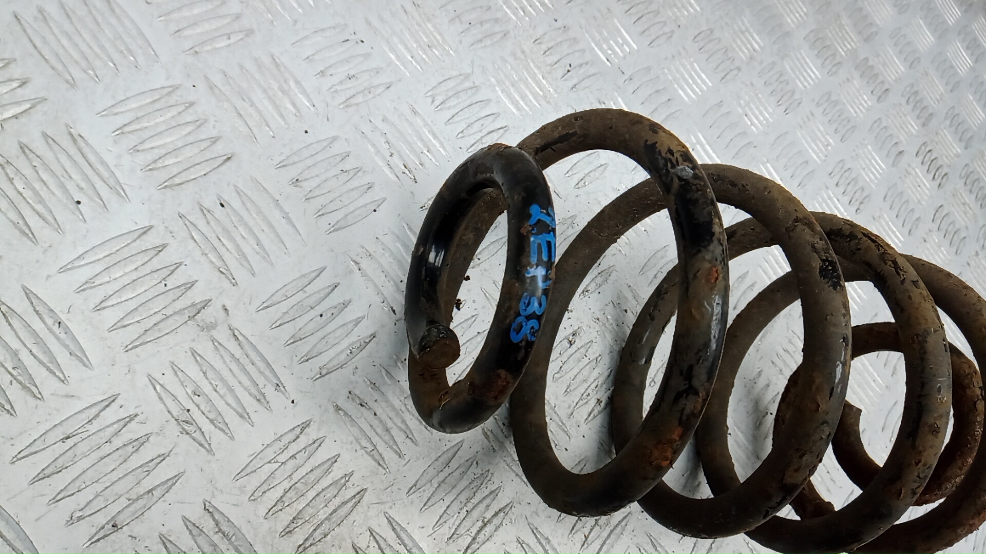 Пружина задняя