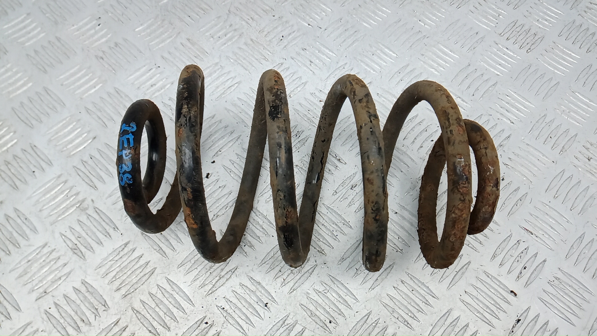 Пружина задняя