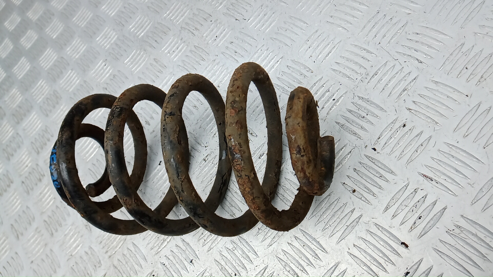 Пружина задняя